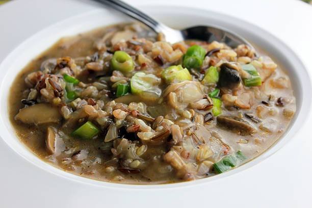 A close-up of a bowl of mushroom and wild rice soup.