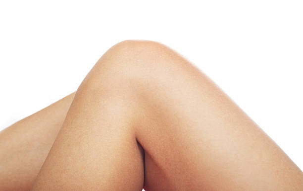 Close-up of two bent knees with smooth, light brown skin.